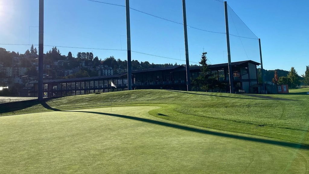 golf-green-with-driving-range-in-background